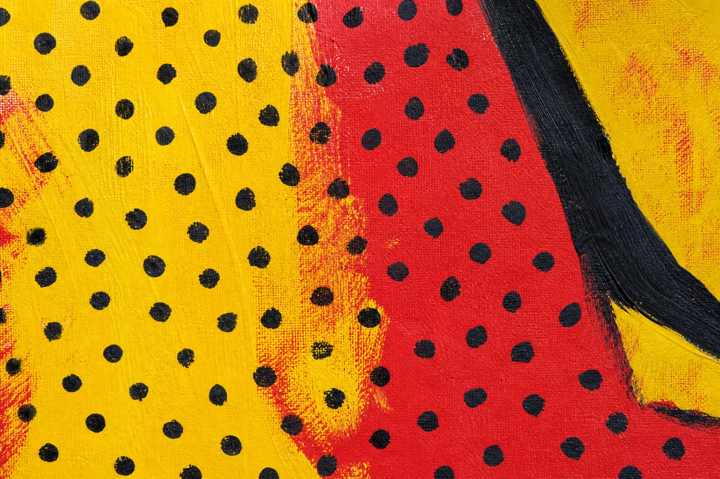 Artwork detail with hand-painted black dots, red and yellow fields, and an imperfect dark contour