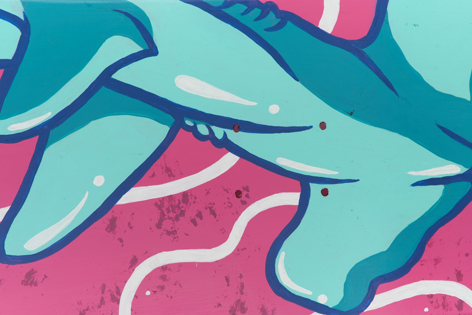 Close detail of a painted teal shark graphic with white highlights on a pink background