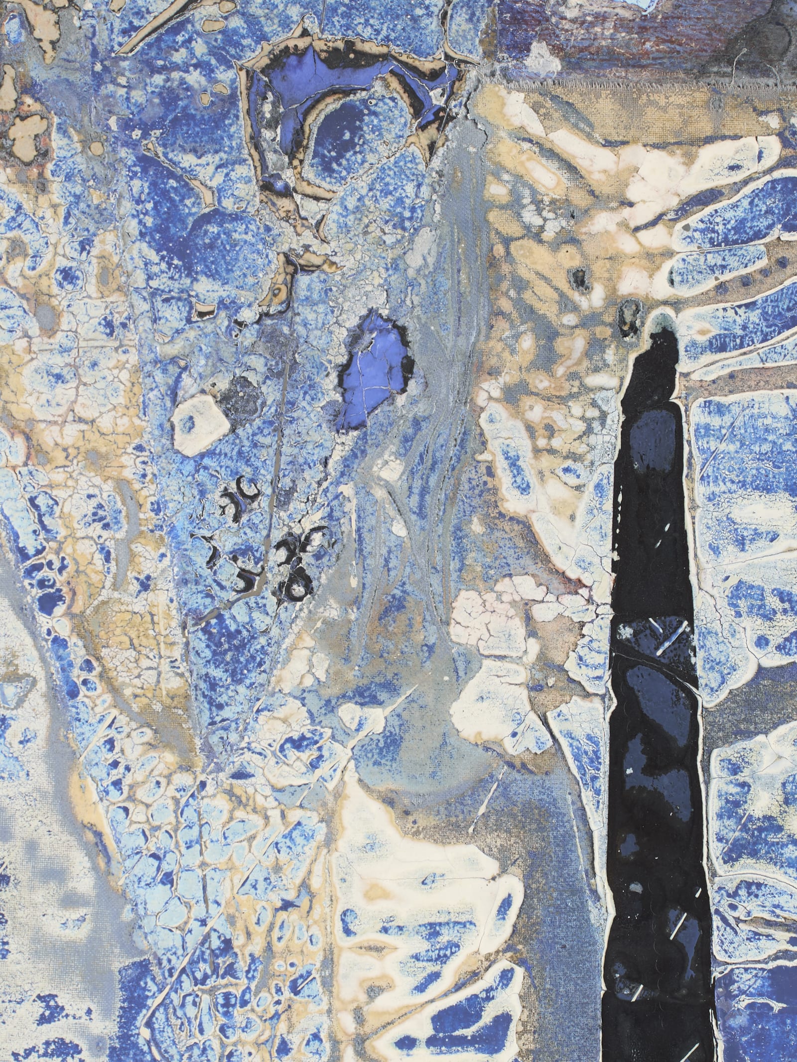 Close detail of a cracked blue and gold textured painting surface with small handwritten archive numbers