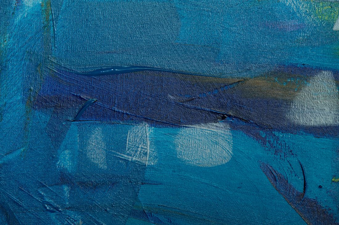 Close-up detail of an abstract painting showing texture and brushwork on canvas
