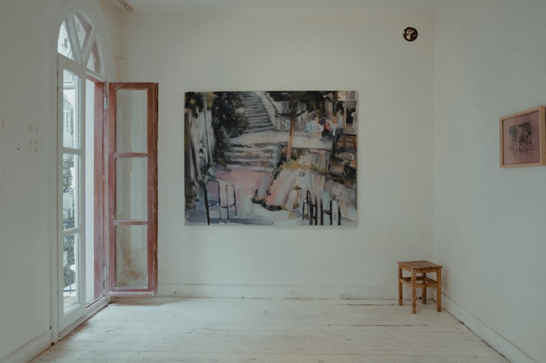 A calm, sunlit gallery room with a single abstract painting on the wall