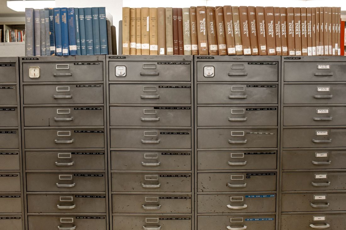 Rows of organized gray steel filing cabinets used for record storage