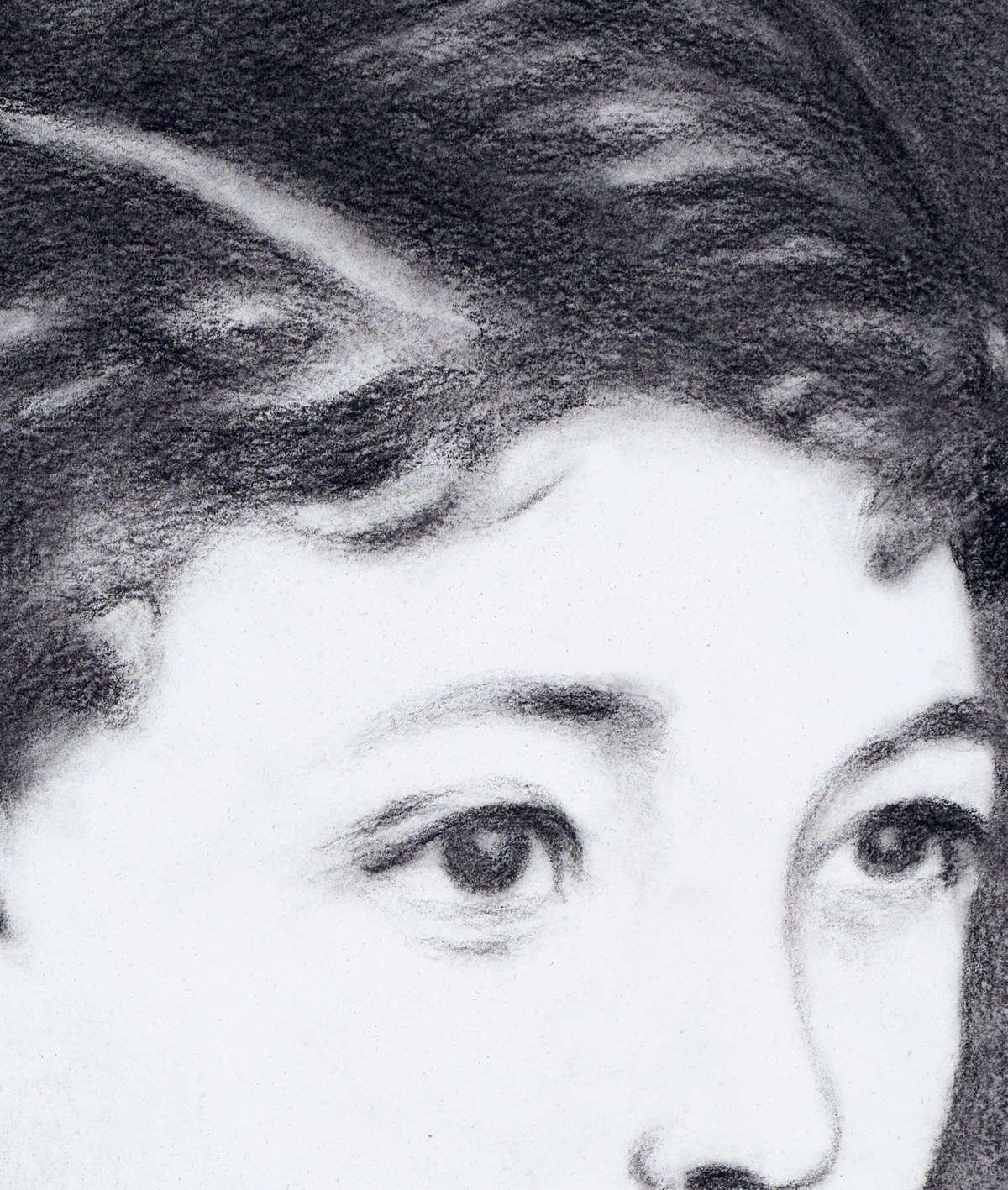 Close detail of a charcoal portrait of a boy, showing the paper grain and each stroke, by Robert Taubart